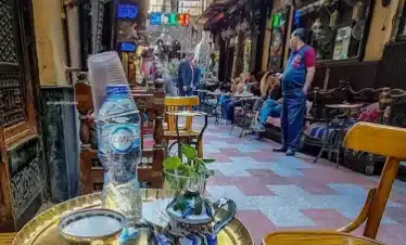 Khan El Khalili Bazaar with shops, souvenirs, and traditional cafés.