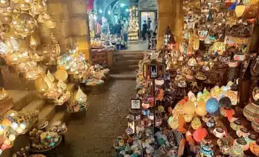 Khan El Khalili Bazaar with shops, souvenirs, and traditional cafés.