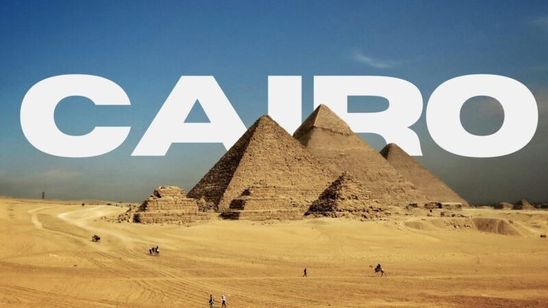 Great Pyramids of Giza with Cairo text in background, iconic landmark of Egypt