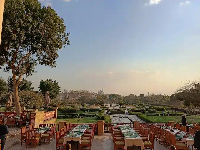 Outdoor dining at Studio Masr Restaurant in Al Azhar Park overlooking historic Cairo