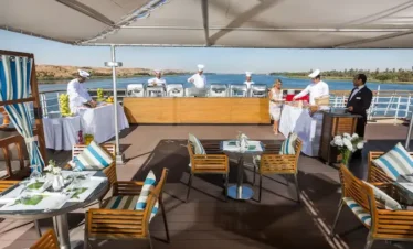 outdoor dining area on Nile cruise with river view