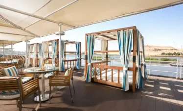 sun deck on Nile cruise with loungers and river view