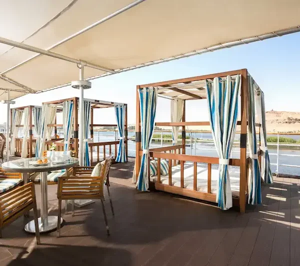 sun deck on Nile cruise with loungers and river view