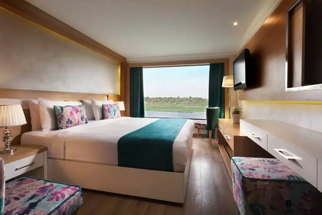 luxury cabin inside Acamar Nile Cruise with panoramic Nile view